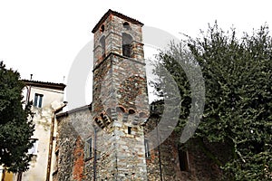 A bell tower in the center of the medieval village of Castelnuovo di Garfagnana, Tuscany