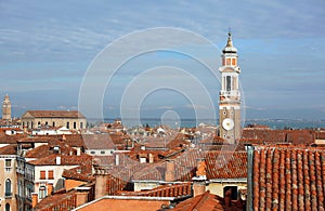 bell tower of Church of the Holy Apostles of Christ and many house in the Cannaregio sestiere of Venice in Italy photo