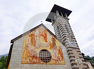 The Bell Tower and the Church of Madonna dell`Aiuto, in Fiera di Primiero. photo