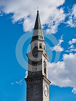 Bell tower church pinzolo Italy against cloudy blue sky