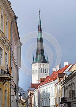 The bell tower of the Church of St. Olaf. Tall beautiful spire of the church. Tallinn, Estonia