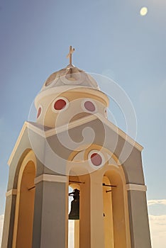 Bell tower of a church at sunset, Santorini island, Greece