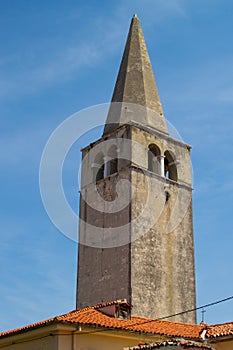 Bell tower of the Euphrasian Basilica also called Cathedral Basilica of the Assumption of Mary in the old town of Porec Parenzo