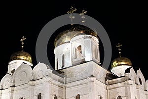 Bell tower and golden domes with crosses. The Cathedral of Christ the Savior at night. Pyatigorsk, Russia