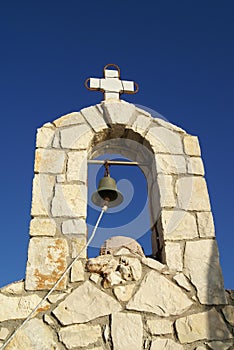 Bell tower of a Greek old church at Kalyves beach, Crete, Greece