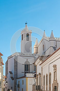 Bell tower of Igreja de Sao Francisco church. View from Rua da Republica. Evora Portugal