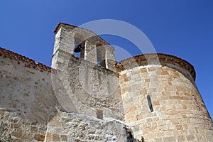 Bell tower and loophole of the Hermitage of San Frutos on a cliff over the river Duraton in Segovia, Spain. photo