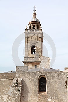 Bell tower of the Mayor church, in the town of Medina Sidonia, Spain photo