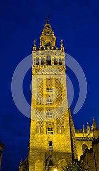 Bell Tower named Giralda in catholic Cathedral of Saint Mary in Seville, Spain