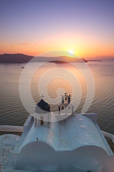 Bell tower of an orthodox church at Santorini, Greece. Honeymoon summer aegean cycladic background.