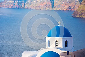 Bell tower of an orthodox church at Santorini, Greece. Honeymoon summer aegean cycladic background.
