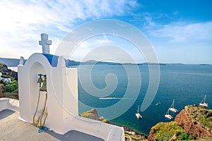 Bell tower of an orthodox church at Santorini, Greece. Honeymoon summer aegean cycladic background.