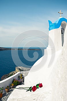 Bell tower of an orthodox church at Santorini, Greece. Honeymoon summer aegean cycladic background.