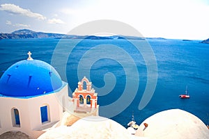 Bell tower of an orthodox church at Santorini, Greece. Honeymoon summer aegean cycladic background.