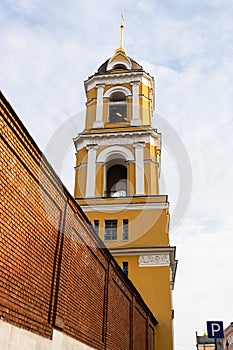 Bell tower over wall of Rozhdestvensky Convent