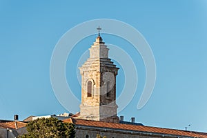 Bell tower of Pater Noster Church under sunset on the top of Mount of Olives, Jerusalem