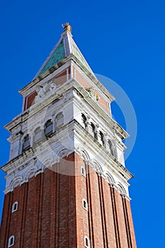 bell tower of Saint Mark in the square of Venice in Italy with blue sky