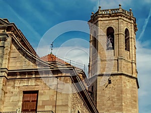 Bell tower of Santa Maria de Alba church in Tarrega Province of Lleida, Catalonia, close-up. Baroque-style medieval temple, photo