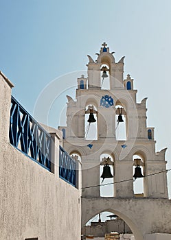 Bell tower of small church in Oia, Santorini island, Greece