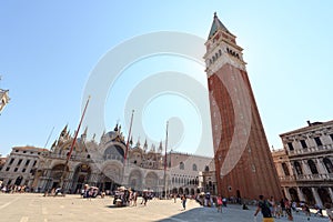 Bell tower St Mark`s Campanile and cathedral church St Mark`s Basilica at Saint Mark`s Square Piazza San Marco in Venice, Ita