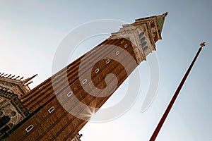 Bell tower in sunlight. San Marco square in Venice, Italy