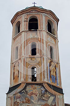 The bell tower of the temple dates from 1877, richly painted. Below it there is a chapel - christening. Asenovgrad, Bulgaria.