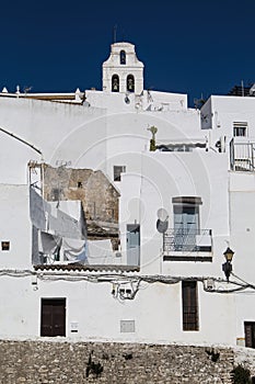 Bell tower and white houses in Vejer de la Frontera, Spain photo