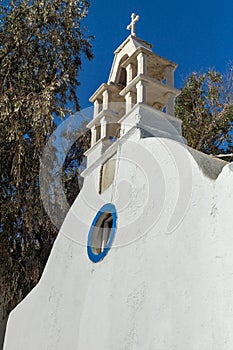 Bell tower of White orthodox church in Mykonos, Cyclades, Greece