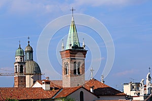 Bell towers and roofs and statue of the Vicenza city in Italy
