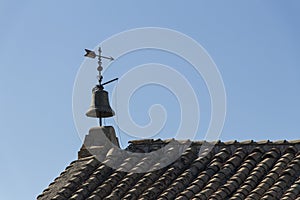 Bell and weather vane on old hermitage roof