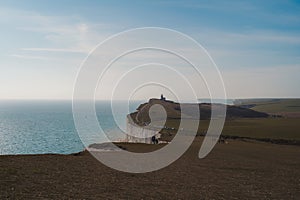 The Belle Tout lighthouse on top of Seven Sisters, Clifftop Paths Nature Reserve. South of England photo