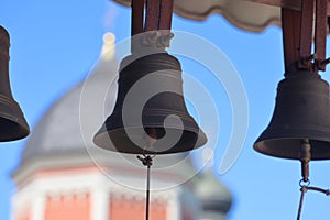 Bells against the background of the Petrovsky Cathedral of the Vysoko Petrovsky monastery, bell ringing, background