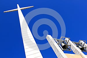 Bells and cross near Padre Pio Church, Italy photo