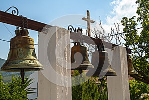 Bells to call to prayer on the island of Kephaloia in Greece photo