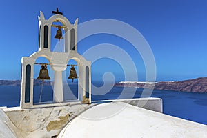 Bells on a tower of a church on Skaros Rock in Santorini