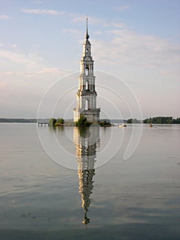 Belltower in the middle of lake photo