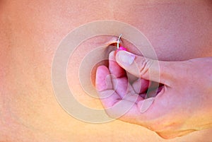 Belly button piercing