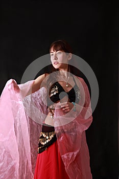 Belly dancer on black background