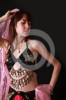 Belly dancer on black background