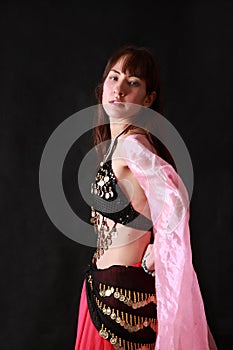 Belly dancer on black background