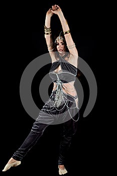 A belly dancer in a dynamic dance figure