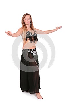 Belly dancer performing with her hands up