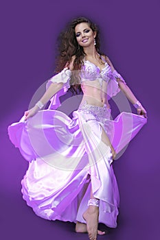 Belly dancer in violet costume