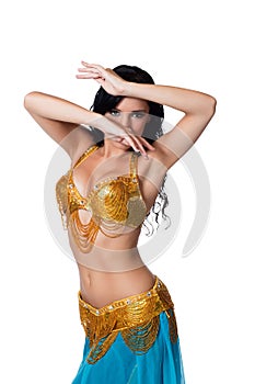 Belly dancer wearing a gold and blue costume