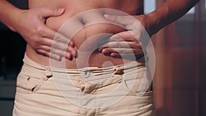 Belly fat close-up. The concept of a beer belly, weight loss