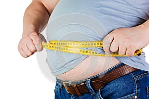 The belly of a fat man isolated on white background. Fat man holding a measuring tape. Weight Loss.