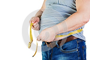 The belly of a fat man isolated on white background. Fat man holding a measuring tape. Weight Loss.