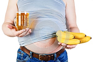 Belly fat man. A man stands before a choice of the beer or fruit