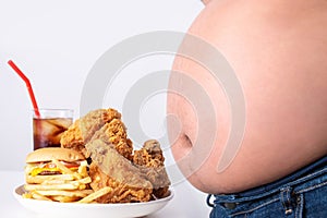 The belly of overweight people with junk food