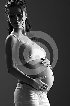Belly of pregnant woman monochrome